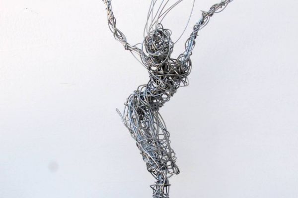sculpture of dancer made in galvanized wire