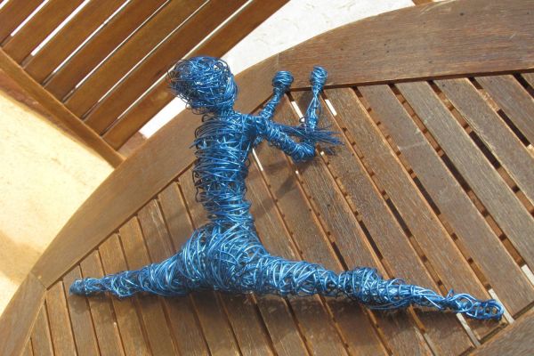 sculpture of woman in wire painted in automotive laquer